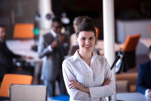 business woman with her staff, people group in background at modern bright office indoors