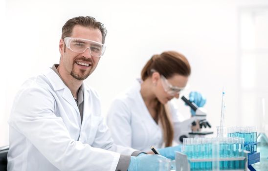 two scientists biologists sitting at the laboratory table.science and research