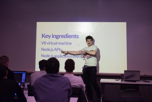 young computer technology students on  code programming class have presentation