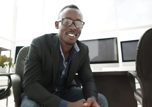 close up. smiling businessman in the workplace.business people