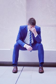 frustrated young business man working on laptop computer at office