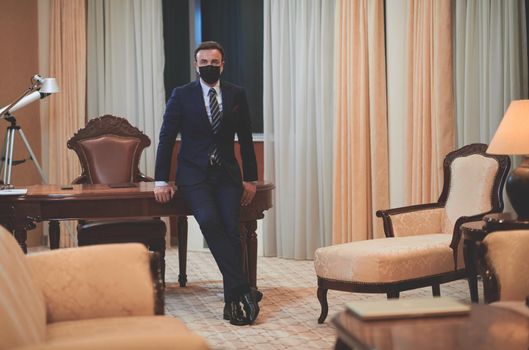 corporate business man wearing protective medical face mask at luxury office