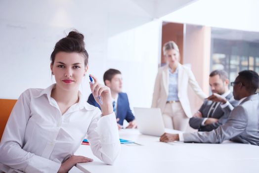 business woman with her staff, people group in background at modern bright office indoors