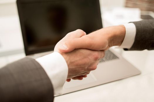 close up.background image of a handshake of business partners.business background