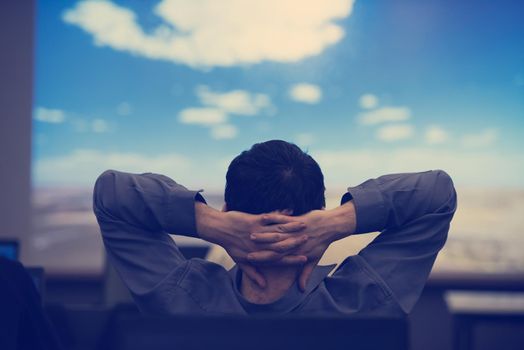 happy  man as audience sitting and relaxing on presentation while looking on beaudiful sky with cloud  and dreaming