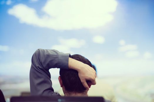 happy  man as audience sitting and relaxing on presentation while looking on beaudiful sky with cloud  and dreaming