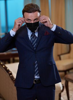 corporate business man wearing protective medical face mask at luxury office