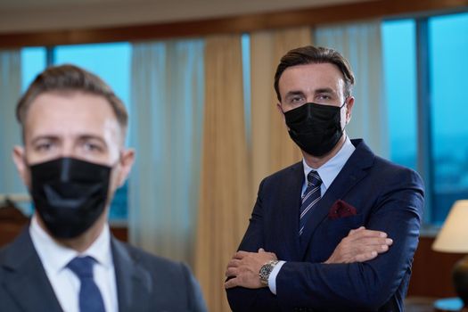 corporate business team wearing crona virus protection face mask keep social distance in luxury office