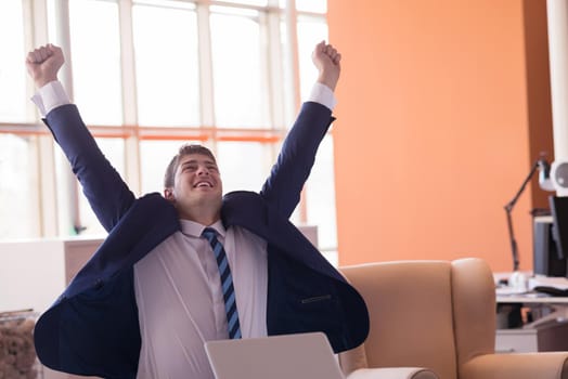 happy young business man portrait in bright modern office indoor