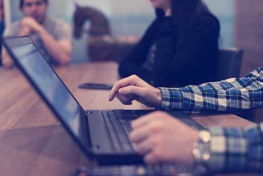 software developer writing programming code on laptop computer