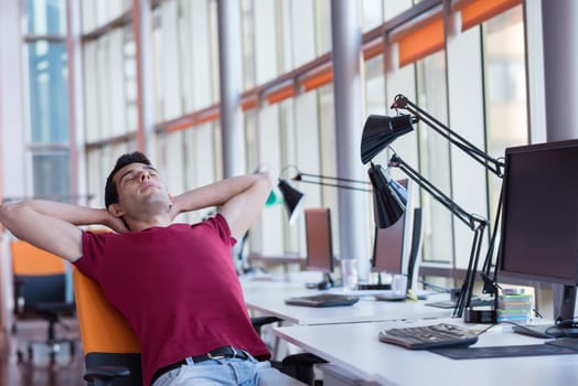 happy young business man portrait in bright modern office indoor