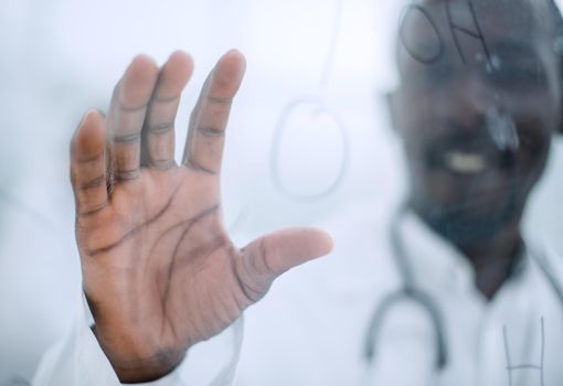 close up.a promising scientist standing in front of a glass Board