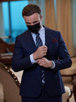 corporate business man wearing protective medical face mask at luxury office