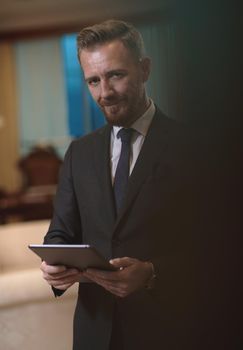 corporate business man using tablet computer in luxury office
