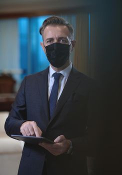 corporate business man wearing protective medical face mask at luxury office