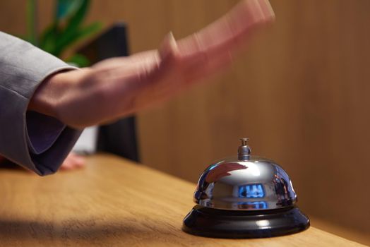 business woman at the reception of a hotel checking in