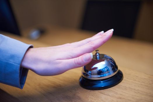 business woman at the reception of a hotel checking in