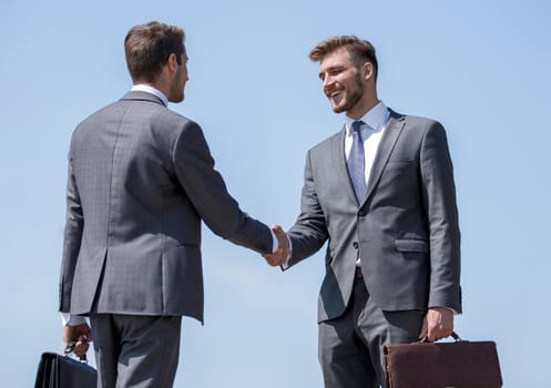 handshake of business people on the background of the sky.photo with copy space