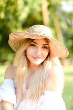 Portrait of young smiling caucasian girl in hat. Concept of beauty, female person and summer fashion.