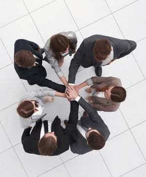 top view.professional business team with their hands folded together.photo with copy space