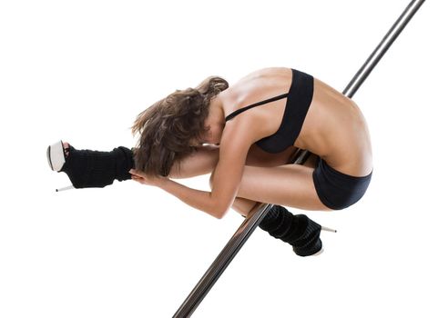 Young sexy woman exercise pole dance against a white background
