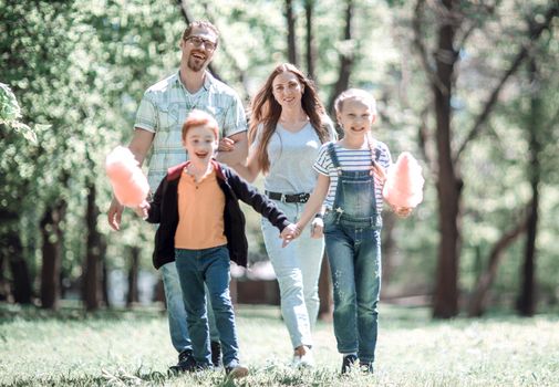 cheerful family spends time in the Park.the concept of family entertainment