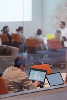 Young female Entrepreneur Freelancer Working Using A Laptop In Coworking space