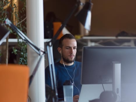 Young Entrepreneur Freelancer Working Using A Laptop In Coworking space