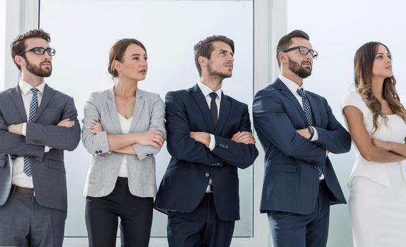 business colleagues standing in a row in the office.photo with copy space