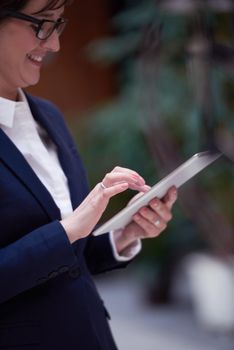 corporate business woman working on tablet computer  at modern office interior