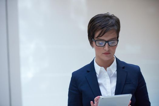 corporate business woman working on tablet computer  at modern office interior