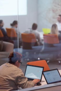 Young female Entrepreneur Freelancer Working Using A Laptop In Coworking space