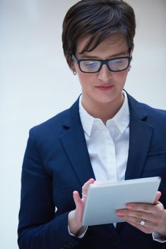 corporate business woman working on tablet computer  at modern office interior