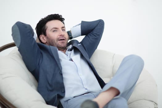 close up.businessman sitting in a comfortable chair.photo with copy space