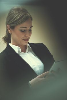 corporate business woman working on tablet computer  at modern office interior