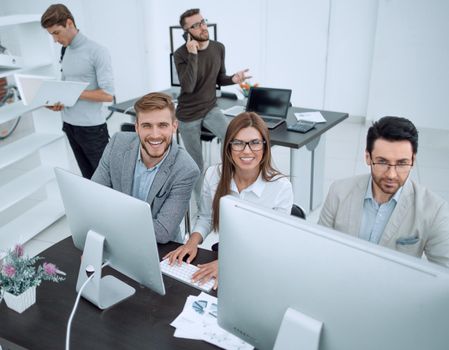 top view.professional business team sitting at the Desk.business concept