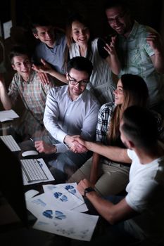 business people shaking hands over the Desk.the concept of teamwork