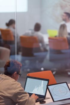 Young female Entrepreneur Freelancer Working Using A Laptop In Coworking space