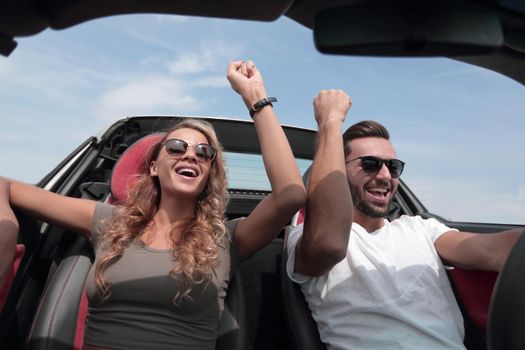 close up.a loving couple travelling in a convertible.rest and travel.