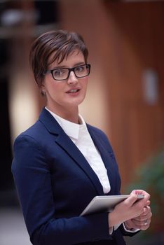 corporate business woman working on tablet computer  at modern office interior