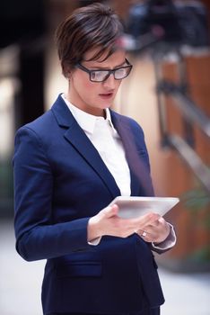 corporate business woman working on tablet computer  at modern office interior