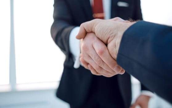 close up.handshake business partners.business concept