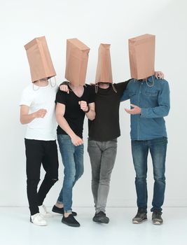 in full growth. a group of men with paper bags on their heads.photo with copy space