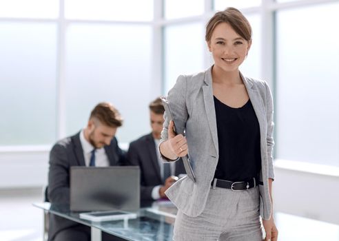 Executive young businesswoman standing in the office.photo with copy space