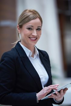 corporate business woman working on tablet computer  at modern office interior