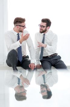 business colleagues talk in an empty office.photo with text space