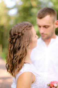 Happy handsome groom with caucasian bride. Concept of married couple and love.