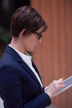 corporate business woman working on tablet computer  at modern office interior