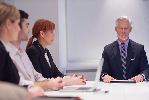 business people group with young adults and senior on meeting at modern bright office interior.