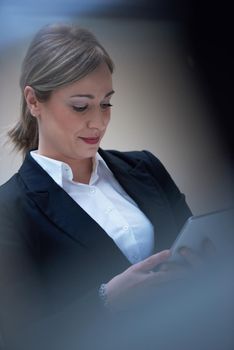 corporate business woman working on tablet computer  at modern office interior